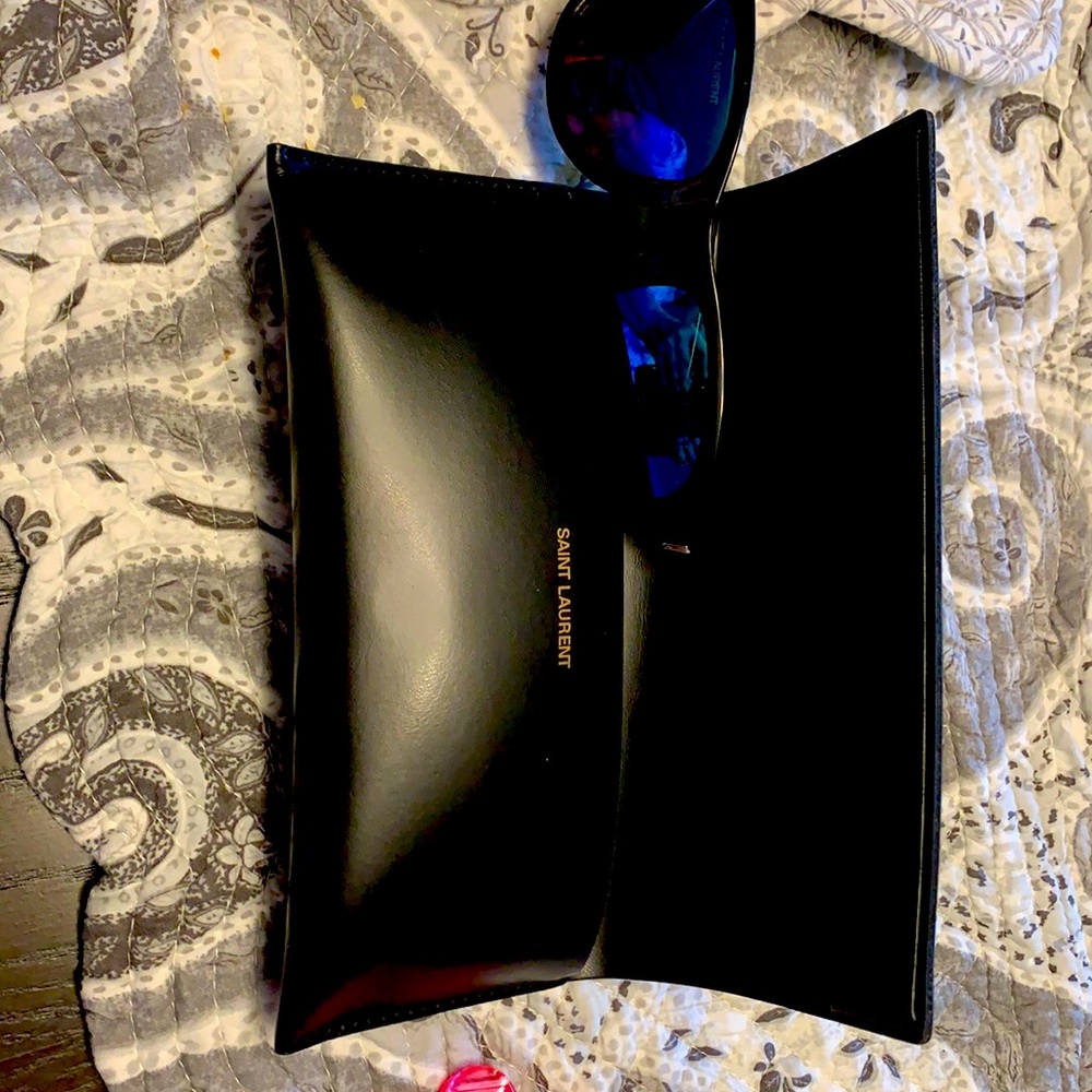 Used vintage Saint Laurent sun glasses.